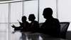 silhouettes at a table 