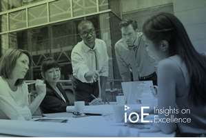 A group of people around a conference table collaborating