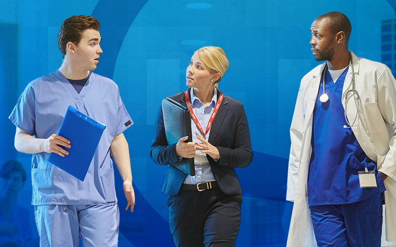 Three healthcare professionals stand together in a hospital or clinic setting, all looking to the right with focused expressions. On the left, a young man in light blue scrubs holds a bright blue clipboard. In the middle, a woman in business attire with a red lanyard and ID badge holds a dark folder and gestures with her right hand. On the right, a man in a white lab coat over royal blue scrubs, with a stethoscope around his neck, has his left hand in his pocket. The background is a semi-transparent, vibrant blue, creating a modern and professional atmosphere.